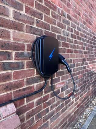 Hypervolt Home 3 Pro EV charger mounted on brick wall – Haywards Heath installation by MLP Electrics